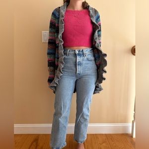 Multicolored crochet cardigan with ruffled lining and pockets, includes belt